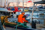 Travel photography:Firsherman in Iraklio (Heraklion) harbour, Grece