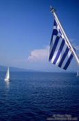 Travel photography:Greek flag with sailing boat, Greece