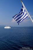 Travel photography:Greek flag with ferry boat, Greece