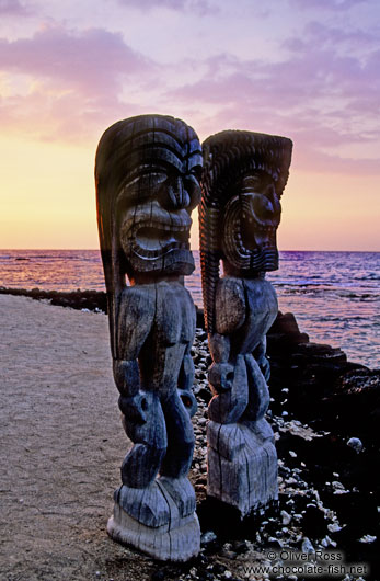 Two guardians at Pu`uhonua o Honaunau during sunset