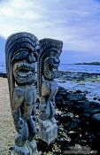 Travel photography:Two guardians at Pu`uhonua o Honaunau, Hawaii USA
