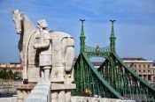 Travel photography:The Freedom Bridge with statue of King Stefan I (founder of Hungary), Hungary