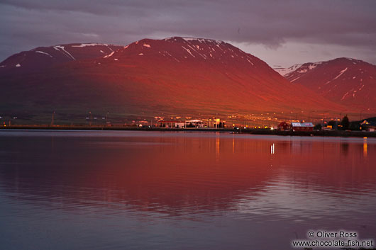 Midnight sun on midsummer night over the fjords at Akureyri