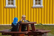 Travel photography:Kids enjoying and ice cream cone at the Siglufjörður camp site, Iceland