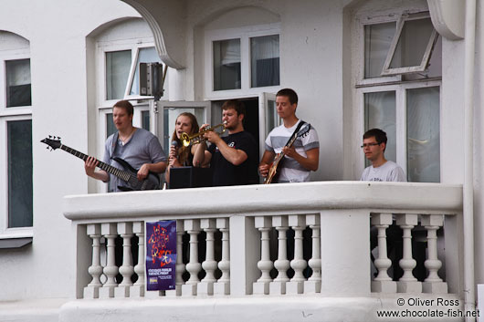 Live music performance in downtown Reykjavik performed on a balcony