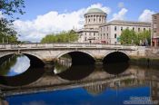 Travel photography:Bridge across the river Liffey in Dublin with Four Courts, Ireland