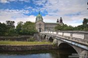 Travel photography:Bridge across the river Corrib in Galway with the cathedral in the background, Ireland