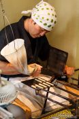 Travel photography:Preparing small biscuits in a street bakery in Kyoto´s Gion district, Japan