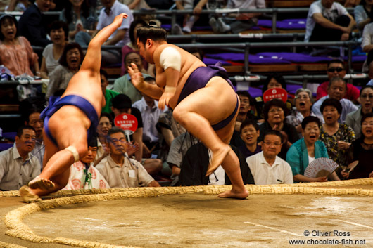 Throwing the opponent out of the ring at the Nagoya Sumo Tournament