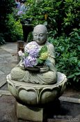 Travel photography:Buddha with flower offerings in Kamakura, Japan