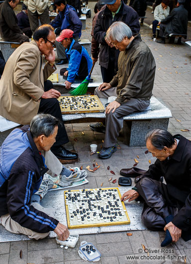 Old men playing Go in a park near the Jongmyo Royal Shrine in Seoul