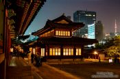 Travel photography:Seoul Deoksugung palace with part of city skyline and Seoul Tower, South Korea