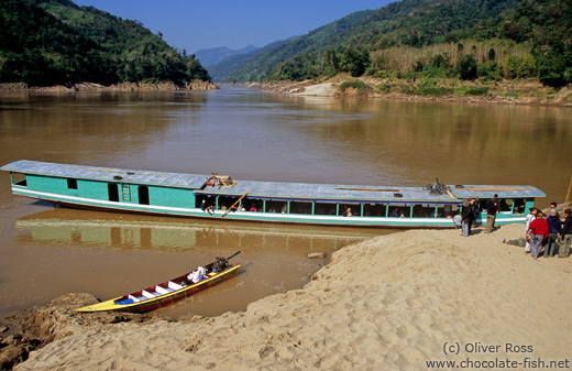 People transport boat on the Mekong River