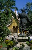 Travel photography:King Sisavang Vong Statue in the Palace Grounds in Luang Prabang, Laos