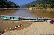 Travel photography:People transport boat on the Mekong River, Laos
