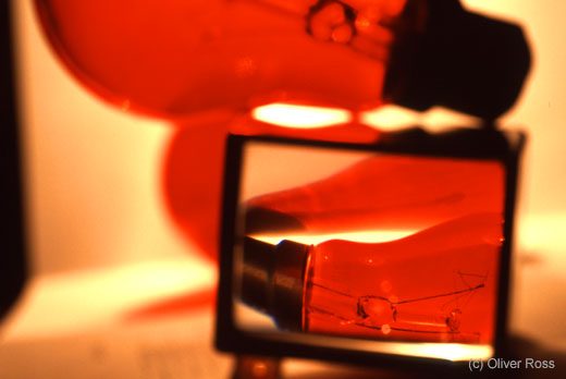 Red light bulbs through a magnifying glass