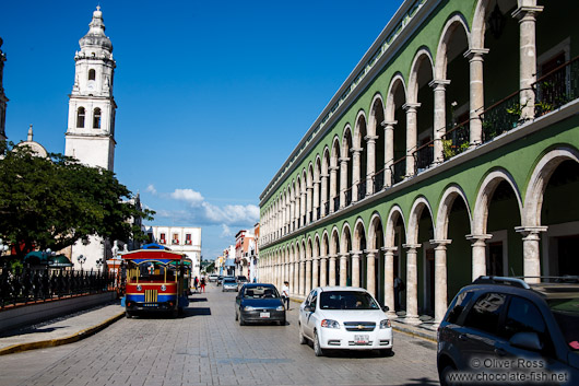 Colonnades along the main square in Campeche with church