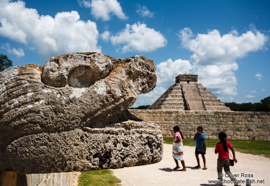 Snake head with pyramid at the Chichen Itza archeological site