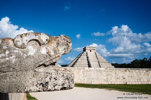 Snake head with Central pyramid at the Chichen Itza archeological site