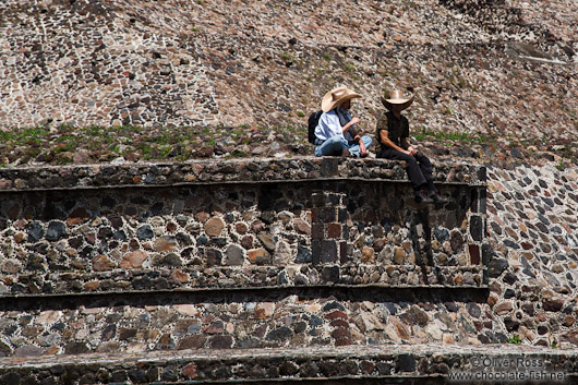 People sitting at the base of the sub pyramid at the Teotihuacan archeological site