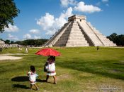 Travel photography:Visitors at the central pyramid of the Chichen Itza archeological site, Mexico