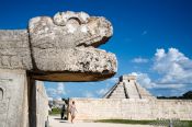 Travel photography:Snake head with Central pyramid at the Chichen Itza archeological site, Mexico