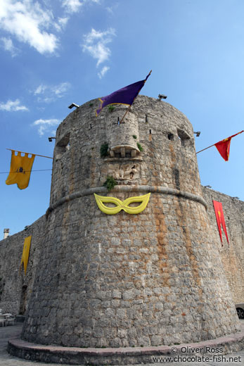 Festive decorations on the city wall in Budva