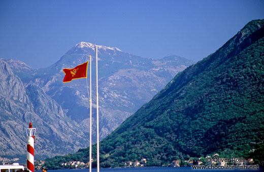 View of mountain range with Montenegrin flag