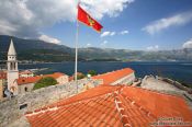 Travel photography:View from Budva castle with Montenegrin flag, Montenegro