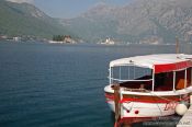 Travel photography:View of Perast harbour with the islands of Sv. Djordje (St. George) and Gospa od Škrpjela (Our Lady of the Rock), Montenegro