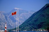 Travel photography:View of mountain range with Montenegrin flag, Montenegro