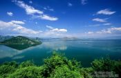 Travel photography:View of Skadarsko jezero (Scutari lake) with isolated monastery, Montenegro