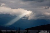 Travel photography:A ray of light breaks trough the clouds in Fiordland National Park, New Zealand