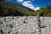 Travel photography:Stone pyramids in a river bed in Mount Aspiring National Park, New Zealand