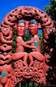 Travel photography:Maori carving of the entwined lovers of Hinemoa and Tutanekai at Whakarewarewa village in Rotorua, New Zealand