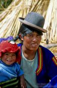 Travel photography:Uros mother with child, Peru