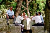 Travel photography:Men Playing Cards in Lisbon`s São Jorge Castle, Portugal