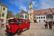 Travel photography:Tourist bus in Bratislava´s city centre with old town hall, Slovakia