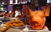 Travel photography:Pig´s heads and saussage for sale at the Bilbao food market, Spain