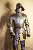 Travel photography:Full body suit of armour on display in the Alcazar castle in Segovia, Spain