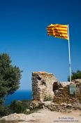 Travel photography:Catalan flag on top of Begur castle, Spain