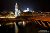Travel photography:Bridge crossing the Onyar river in Girona with cathedral, Spain