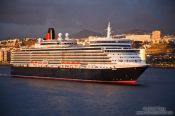 Travel photography:The Queen Mary cruise ship enters Las Palmas harbour at sunrise, Spain