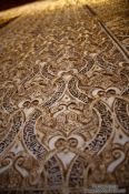Travel photography:Arabesque wall decoration the the Sala de los Abencerrajes (Hall of the Abencerrages) in the Nazrin palace of the Granada Alhambra, Spain