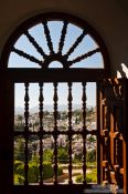 Travel photography:View of Granada through a window at the Generalife of the Granada Alhambra, Spain