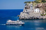 Travel photography:Port de Soller light house and tourist boat, Spain