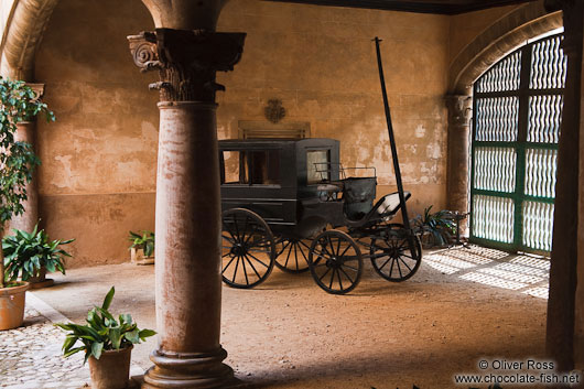 Old horse cart inside a classical baroque patio in a Palma house