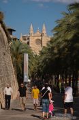Travel photography:Promenade along the sea side of Palma with the cathedral La Seu in the background, Spain