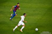 Travel photography:Mesut Özil pursued by Sergio Busquets, Spain