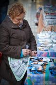 Travel photography:A stall keeper is counting her money in Valencia, Spain